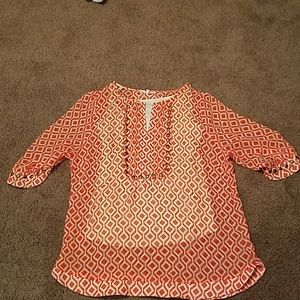 Sheer patterned top with brass stud detail